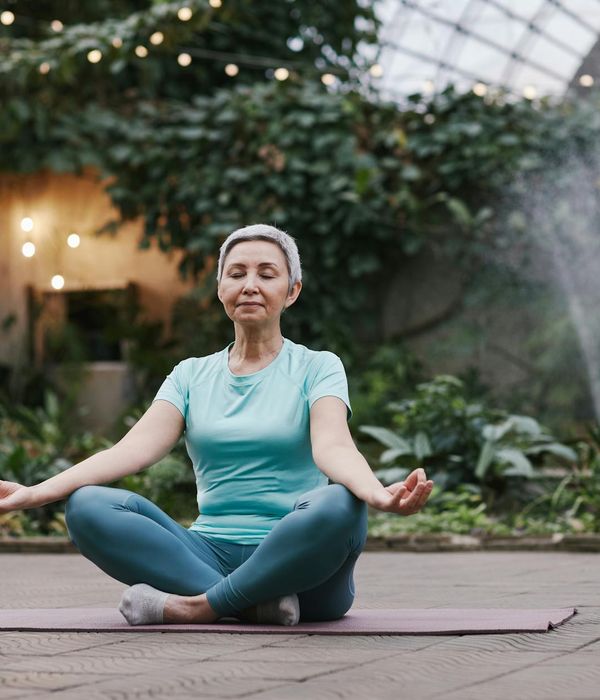 Woman in a serene yoga pose, finding balance and inner peace.